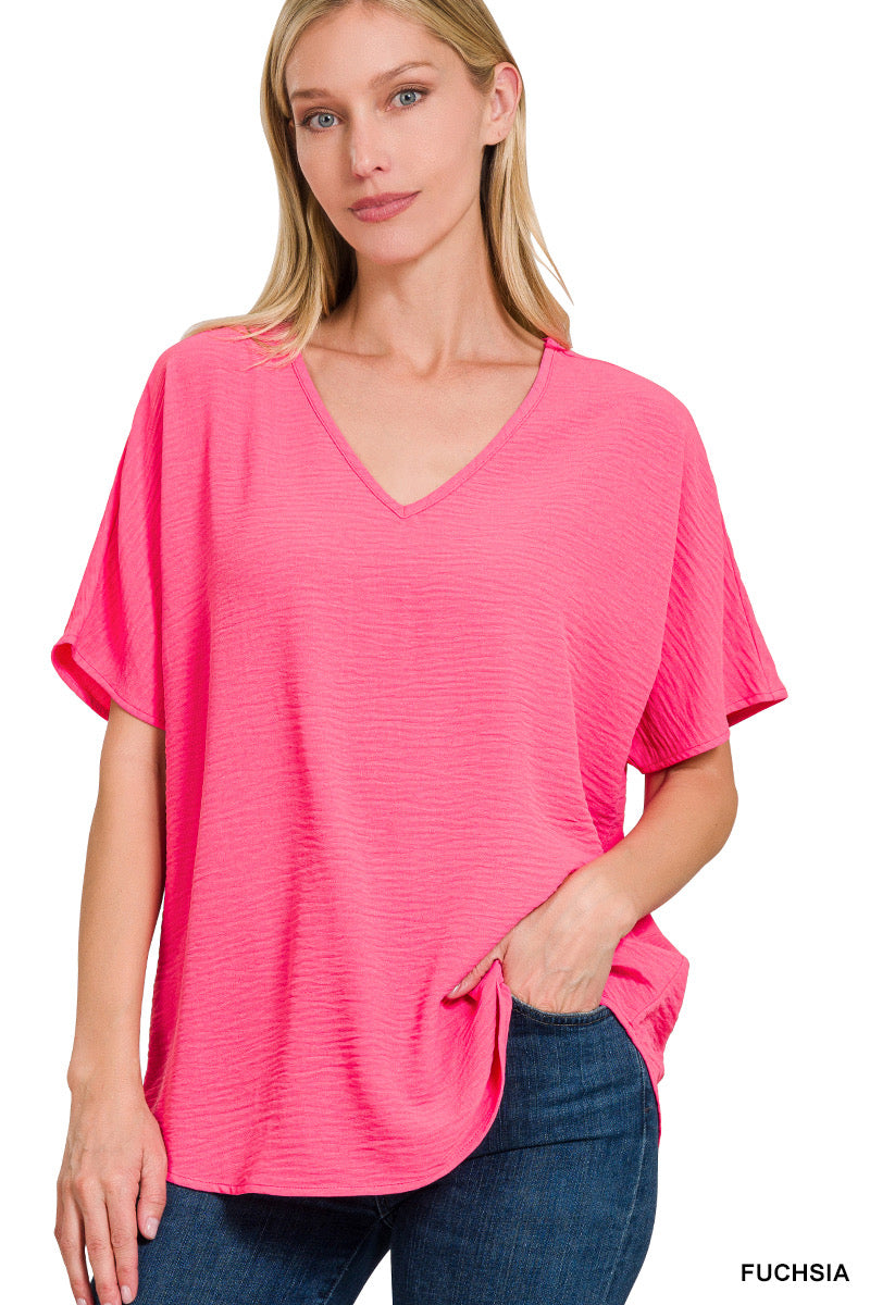 WOVEN AIRFLOW V-NECK SHORT SLEEVE TOP - FUCHIA